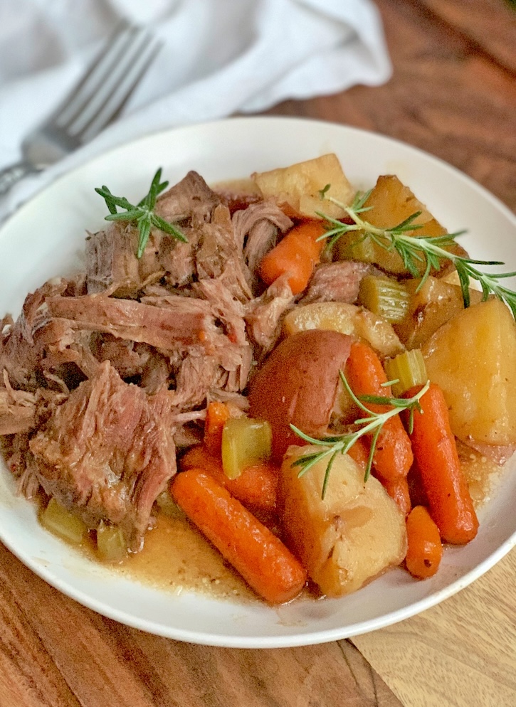 Simple Slow Cooker Pot Roast Recipe With Vegetables (potatoes, carrots and celery).