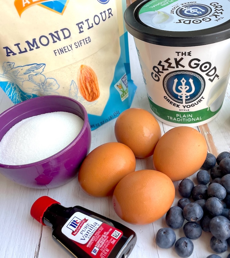 Ingredients needed to make healthy low carb blueberry muffins with almond flour and greek yogurt. 